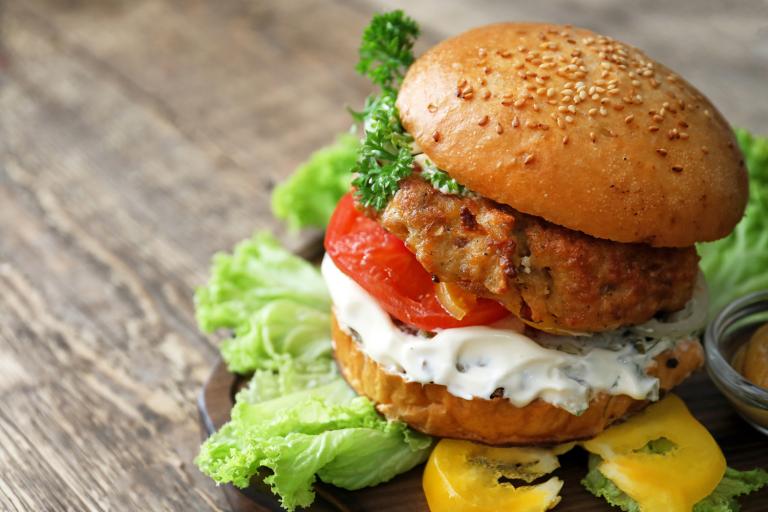 Turkey burger on a rustic wooden table background
